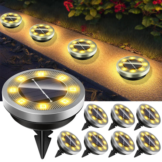 Solar-Bodenleuchten IP65 mit warmweißen LEDs entlang eines Gartenwegs